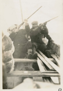Image of Borup, Bartlett shooting from boat